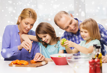 Image showing happy family with two kids making dinner at home