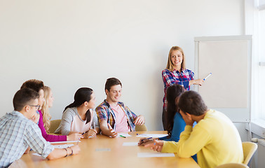 Image showing group of smiling students with white board