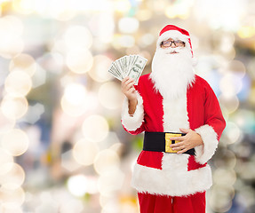 Image showing man in costume of santa claus with dollar money