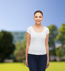 Image showing smiling young woman in blank white t-shirt