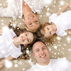 Image showing parents and two girls lying on floor at home