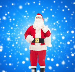 Image showing man in costume of santa claus with bag