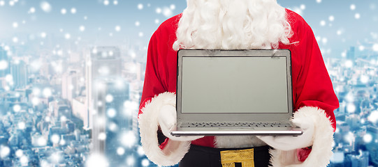 Image showing close up of santa claus with laptop