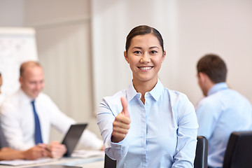 Image showing group of smiling businesspeople meeting in office