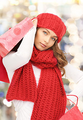 Image showing smiling young woman with shopping bags