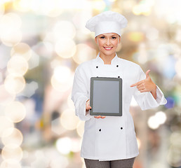 Image showing smiling female chef with tablet pc blank screen