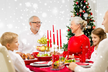 Image showing smiling family having holiday dinner at home