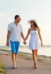 Image showing smiling couple walking outdoors