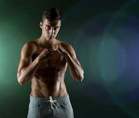 Image showing young man in fighting or boxing position