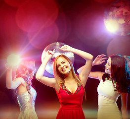 Image showing three smiling women dancing in the club