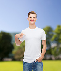 Image showing smiling young man in blank white t-shirt