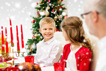 Image showing smiling family having holiday dinner at home