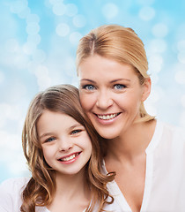 Image showing smiling mother and little girl