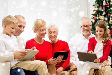 Image showing smiling family with tablet pc computers at home