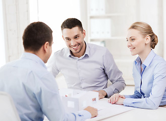 Image showing couple looking at model of their house at office