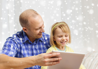 Image showing happy father and daughter with tablet pc computer