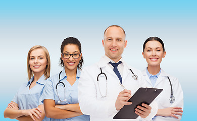 Image showing group of smiling doctors with clipboard