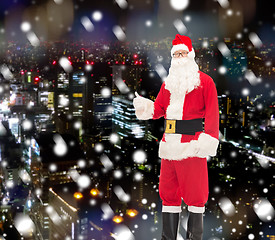 Image showing man in costume of santa claus showing thumbs up