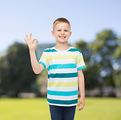 Image showing little boy in casual clothes making ok gesture