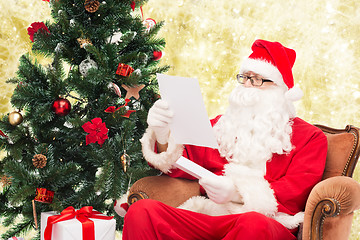 Image showing man in costume of santa claus with letter