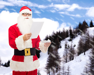 Image showing man in costume of santa claus with letter