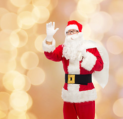 Image showing man in costume of santa claus with bag