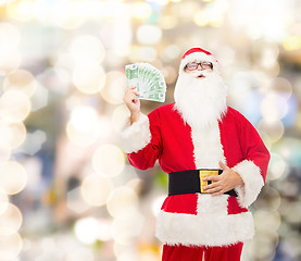 Image showing man in costume of santa claus with euro money