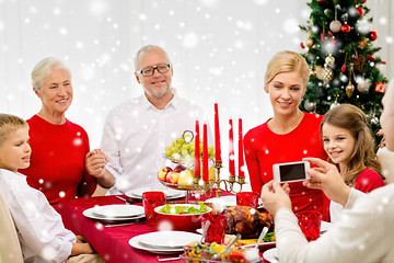 Image showing smiling family having holiday dinner at home