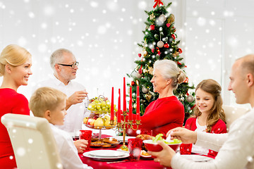 Image showing smiling family having holiday dinner at home