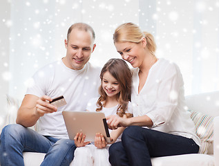 Image showing happy family with tablet pc and credit card