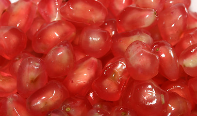 Image showing Photo of the juicy red pomegranate seeds