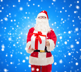 Image showing man in costume of santa claus with gift box