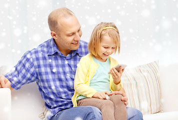 Image showing happy father and daughter with smartphone