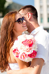 Image showing smiling couple in city