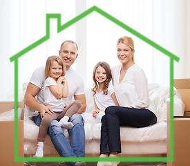 Image showing smiling parents and two little girls at new home