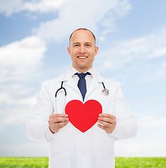 Image showing smiling male doctor with red heart and stethoscope