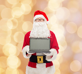 Image showing man in costume of santa claus with laptop