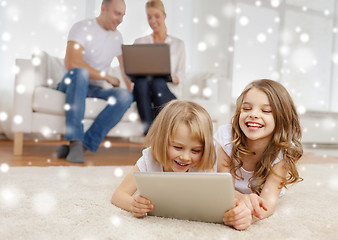 Image showing happy family with tablet pc computers