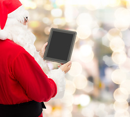 Image showing man in costume of santa claus with tablet pc