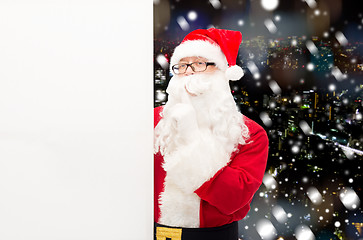 Image showing man in costume of santa claus with billboard