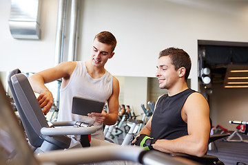 Image showing men exercising on gym machine