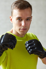 Image showing young man in boxing gloves