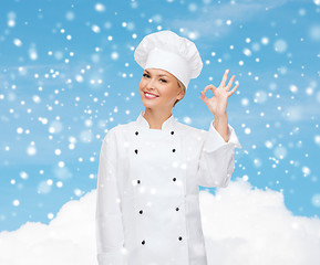 Image showing smiling female chef showing ok hand sign