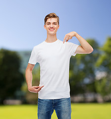 Image showing smiling young man in blank white t-shirt