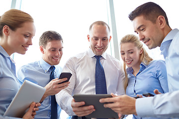 Image showing business people with tablet pc and smartphones