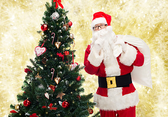 Image showing santa claus with bag and christmas tree