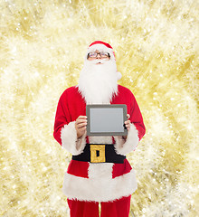 Image showing man in costume of santa claus with tablet pc