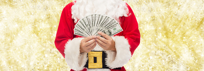 Image showing close up of santa claus with dollar money