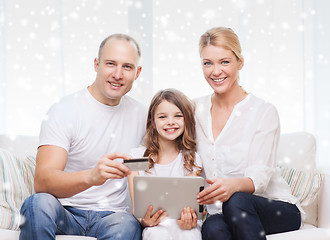 Image showing happy family with tablet pc and credit card