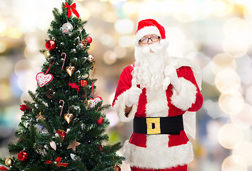 Image showing santa claus with bag and christmas tree